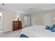 Spacious bedroom featuring neutral walls, ample closet space, and a ceiling fan at 115 Perth Pl, Durham, NC 27712