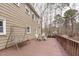 View of the deck with outdoor furniture and a swing at 115 Perth Pl, Durham, NC 27712