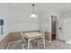 Cozy dining area with a table and chairs, with adjoining kitchen featuring modern appliances at 115 Perth Pl, Durham, NC 27712
