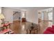 Spacious living room with hardwood floors and neutral walls, leading into other rooms in the home at 115 Perth Pl, Durham, NC 27712