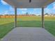 Covered porch offering views of the expansive backyard at 120 Whistling Way # Cary Traditiol, Lillington, NC 27546