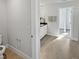Bathroom with tile flooring, a modern toilet paper holder, and a view to a walk-in closet at 120 Whistling Way # Cary Traditiol, Lillington, NC 27546