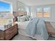 Inviting bedroom with large windows, stylish furnishings, and plenty of natural light at 120 Whistling Way # Cary Traditiol, Lillington, NC 27546