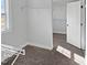 Walk-in closet with wire shelving, neutral carpeting, and natural light at 120 Whistling Way # Cary Traditiol, Lillington, NC 27546