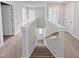Upper hallway featuring neutral carpet, white walls and trim, and multiple doorways at 120 Whistling Way # Cary Traditiol, Lillington, NC 27546