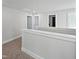 Hallway with neutral carpet and trim, white walls and multiple doorways at 120 Whistling Way # Cary Traditiol, Lillington, NC 27546