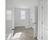 Well-lit laundry room featuring tile floors, a window, and washer/dryer hookups at 120 Whistling Way # Cary Traditiol, Lillington, NC 27546