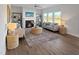Bright living room featuring a fireplace, lots of natural light and wood flooring at 120 Whistling Way # Cary Traditiol, Lillington, NC 27546