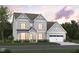 Charming two-story home with light blue siding, a two-car garage, and well-manicured front lawn at 1204 Opal Ln # 93, Durham, NC 27705