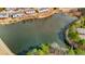 Aerial view of the pond and the surrounding houses and walking path at 1208 Anora Dr, Apex, NC 27502