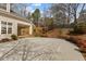View of the backyard brick patio and deck area with nice landscaping on a sunny day at 1208 Anora Dr, Apex, NC 27502