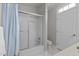 Bathroom with a shower-tub combo, white tiling, and natural light from a window at 1208 Anora Dr, Apex, NC 27502