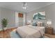 Comfortable bedroom with hardwood floors, a ceiling fan, and an inviting bed at 1208 Anora Dr, Apex, NC 27502