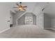 Spacious bonus room features neutral walls and carpet, ceiling fan and good natural light at 1208 Anora Dr, Apex, NC 27502