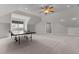 Large bonus room features ping pong table, neutral walls and carpet, and good natural light at 1208 Anora Dr, Apex, NC 27502