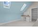 Bright bonus room featuring skylights, built in desk, and plenty of open space at 1208 Anora Dr, Apex, NC 27502