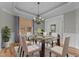 Elegant dining room featuring stylish chandelier and ample seating for formal meals at 1208 Anora Dr, Apex, NC 27502