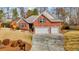 Charming brick home with a two-car garage and well-maintained front yard at 1208 Anora Dr, Apex, NC 27502