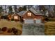 Charming brick home with a two-car garage in the evening at 1208 Anora Dr, Apex, NC 27502