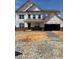 New construction home showing the front of a two-story house with a two-car garage and unfinished landscaping at 1208 Opal Ln # 92, Durham, NC 27705
