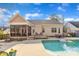 Inviting backyard featuring an in-ground pool, patio, and screened-in porch for relaxation at 149 Winterberry St, Clayton, NC 27527