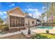 Charming backyard featuring a screened porch, patio, and inviting in-ground pool at 149 Winterberry St, Clayton, NC 27527