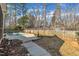 Spacious backyard with an in-ground pool, patio area, and landscaping, perfect for outdoor gatherings at 149 Winterberry St, Clayton, NC 27527