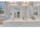 Double sink vanity in a bathroom with a large mirror and decorative lighting at 149 Winterberry St, Clayton, NC 27527