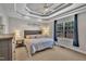 Spacious bedroom with a decorative tray ceiling, ceiling fan and large window for natural light at 149 Winterberry St, Clayton, NC 27527