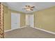 This bedroom features neutral walls, carpeted floors, and an ensuite bathroom at 149 Winterberry St, Clayton, NC 27527
