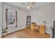 This bedroom features a ceiling fan, natural light, and light wood flooring at 149 Winterberry St, Clayton, NC 27527