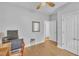 This bedroom features neutral walls, light wood floors, and an en suite bathroom at 149 Winterberry St, Clayton, NC 27527