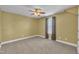 This bedroom features neutral walls, carpeted floors, and a ceiling fan at 149 Winterberry St, Clayton, NC 27527