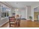 A dining area with a view of the front yard and entrance to laundry room at 149 Winterberry St, Clayton, NC 27527