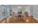 Charming dining area featuring hardwood floors and French doors to the exterior at 149 Winterberry St, Clayton, NC 27527
