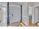 Bright entryway with hardwood floors, white trim, and views into the living area at 149 Winterberry St, Clayton, NC 27527