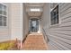 Close-up of front door showing brick steps and portico at 149 Winterberry St, Clayton, NC 27527
