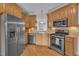 A kitchen with stainless steel appliances and a view of the sink and window at 149 Winterberry St, Clayton, NC 27527