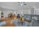 Open-concept living room with hardwood floors and a seamless flow to the dining area at 149 Winterberry St, Clayton, NC 27527