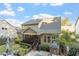 Spacious backyard featuring a screened porch, outdoor kitchen, patio, and lush landscaping at 1608 Doubles Ct, Raleigh, NC 27609