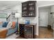 Bar area with a wine refrigerator, wine rack, and glassware storage at 1608 Doubles Ct, Raleigh, NC 27609