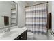 Bathroom featuring a vanity with a sink, a toilet, and a shower with a curtain at 1608 Doubles Ct, Raleigh, NC 27609