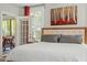 Well-lit bedroom featuring a trey ceiling, neutral tones, and access to a screened-in outdoor area at 1608 Doubles Ct, Raleigh, NC 27609