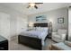 Bedroom featuring a bed, chair, and two closets at 1608 Doubles Ct, Raleigh, NC 27609