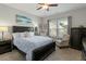 Bedroom featuring a bed, chair, and a window with blinds at 1608 Doubles Ct, Raleigh, NC 27609