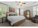 Comfortable bedroom featuring plantation shutters, trey ceiling, and a large bed with neutral decor at 1608 Doubles Ct, Raleigh, NC 27609