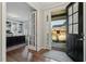 Open entryway with a view of the office and front porch at 1608 Doubles Ct, Raleigh, NC 27609