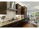 Well-appointed kitchen with granite countertops, stainless appliances, and eat-in breakfast nook with ample sunlight at 1608 Doubles Ct, Raleigh, NC 27609