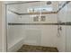 Tiled shower with a glass door, a bench, and decorative tile accents at 1608 Doubles Ct, Raleigh, NC 27609