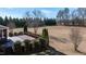 Expansive backyard with a wooden deck overlooking a lush green lawn and mature trees at 17 Beckwith Ave, Clayton, NC 27527